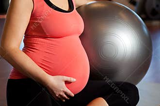 Pregnant woman doing relaxation exercise