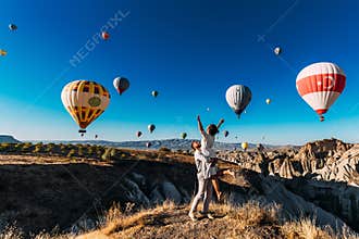 Wedding travel. Honeymoon trip. Couple in love among balloons. A guy proposes to a girl. Couple in love in Cappadocia. Couple in