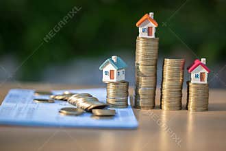 Coins and financial statement or saving account book on table, Business, finance, saving money, property ladder or mortgage loan