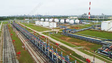 Flycam Moves over Refinery Complex with Reservoirs and Pipelines