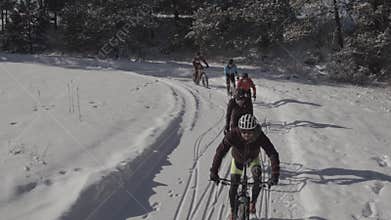 Mountain Bikers riding in the Colorado snow