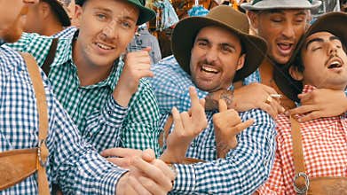 September 17, 2017 - Oktoberfest, Munich, Germany: Merry company of young people in national Bavarian suits Lederhose