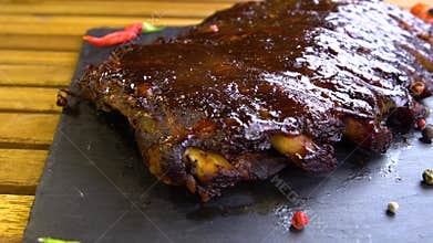 Grilled bbq ribs on stone plate