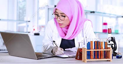 Muslim scientist making research report