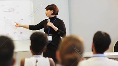 Speaker with microphone at business conference