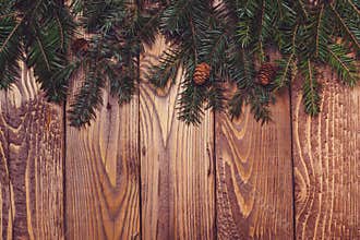 Fir tree branches on rustic wooden background. Christmas holiday