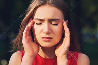 Woman with headache, migraine or stress.
