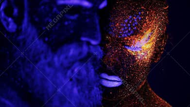 Man and woman face in ultraviolet light