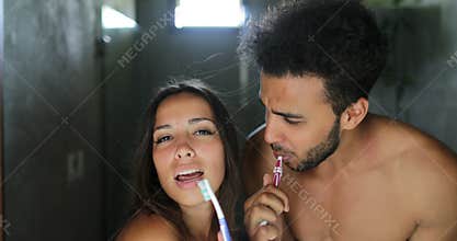 Couple Brushing Teeth In Bathroom, Cheerful Man And Woman Happy Smiling Dancing Doing Morning Hygiene