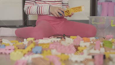 Girl playing with building blocks