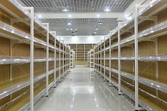 Empty shelves of supermarket interior