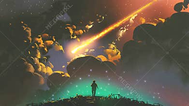 Boy looking the meteor in the colorful sky