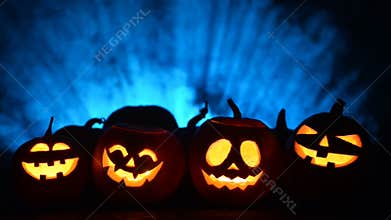 Halloween pumpkins on smoky background