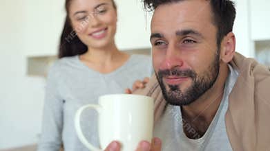 Close up of ill man feeling relief after wife help