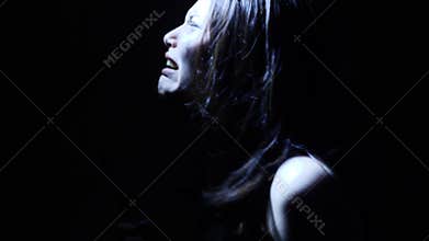 Portrait of a horror Halloween Scream inspired teen girl with a knife