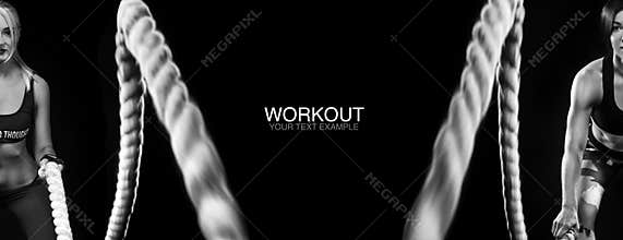 Battle ropes session. Attractive young fit and toned sportswomen working out in functional training gym doing exercise