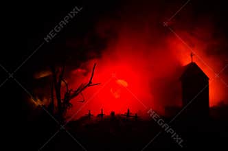 Scary view of zombies at cemetery dead tree, moon, church and spooky cloudy sky with fog, Horror Halloween concept
