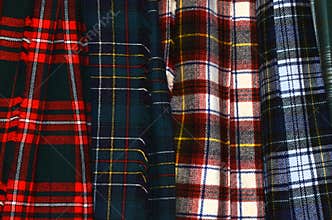 Assorted colorful hanging tartan kilts