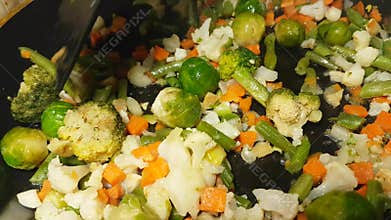 Vegetables are fried in a broccoli pan