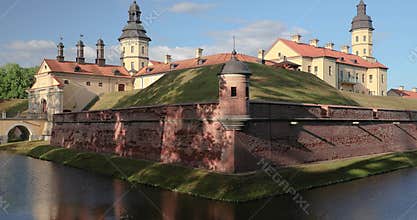 Nesvizh, Minsk Region, Belarus. Niasviz Castle Or Nesvizh Castle And Moat In Sunny Summer Day. Residential Castle Of