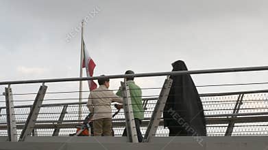 Tabiat bridge, people walking in modern architectural landmark structure