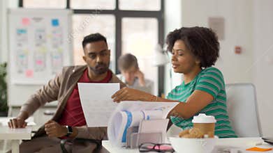 Creative office workers discussing project