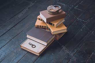 A stack of books on the floor