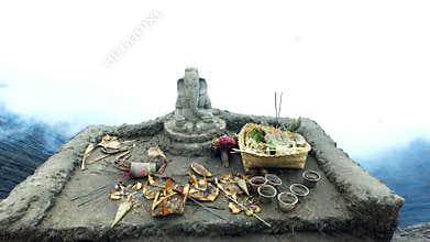 Altar with Ganesha hindu God on top of the bromo volcano crater on Java Indonesia