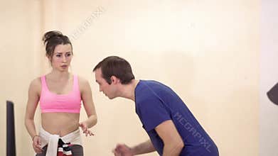 A young guy shows the learned dance movement to the coach