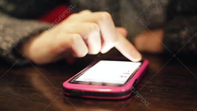 Hands of businesswoman scrolling on smartphone, chatting with client online.