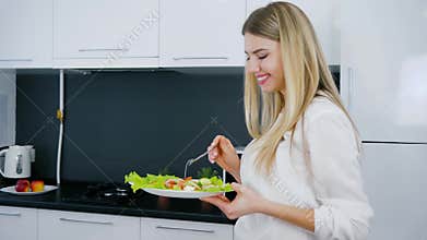 Healthy lifestyle of young woman with plate of food into hand for breakfast