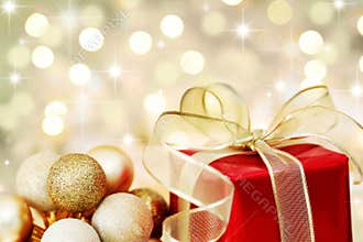 Christmas gift on defocused lights background