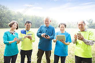 Happy seniors using smart phone
