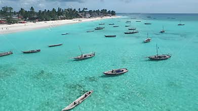 Fishermen`s boats near touristic beach in Zanzibar, aerial