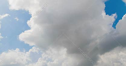 Loop of white clouds over blue sky timelapse movement, climate change