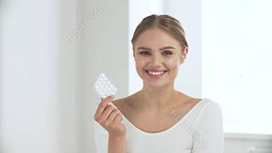 Healthcare. Woman With Blister Of Pills Smiling At Camera