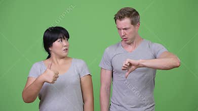 Young multi-ethnic couple having different decisions together