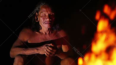 Huaorani Hunter Resting By The Fire