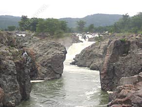 Cascading of water of river Kaveri at Hogenakkal Falls between rocks