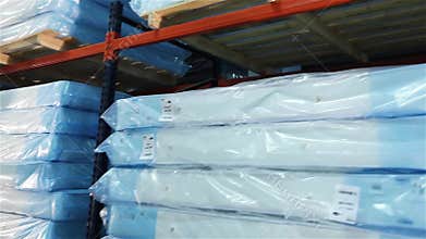 Loading of a warehouse mattresses, orthopedic mattresses on shelves, a warehouse complete set mattresses, an industrial