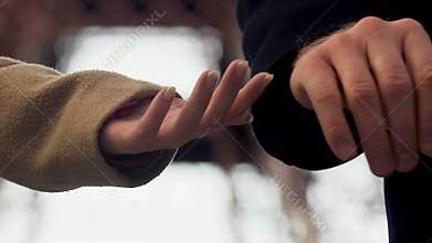 Man letting go woman hand and leaving, couple breaking up outdoor, unshared love