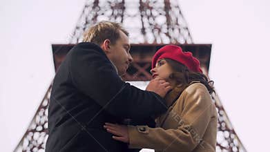 Handsome man tenderly kissing his beloved woman saying goodbye, painful breakup
