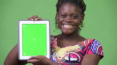 Young African woman showing digital tablet