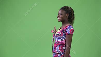 Profile view of young African woman smiling