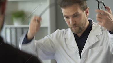 Medical consultation, doctor preparing listen to heartbeat with stethoscope