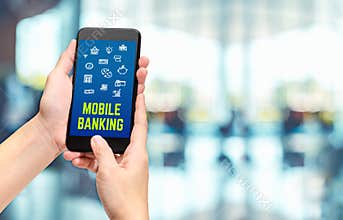 Hand holding mobile with mobile banking apps on smartphone scree