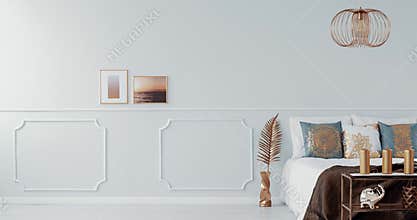 Gold lamp above a bed in bright bedroom interior with gold armchair. Video