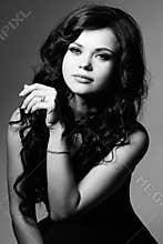 Black and white portrait of young model with long hair.