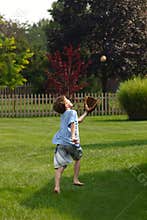 Boy Trying to Catch Ball