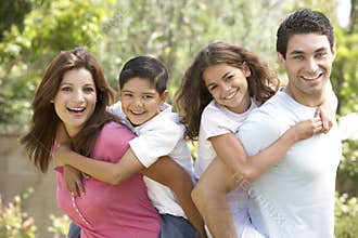 Portrait of Happy Family In Park